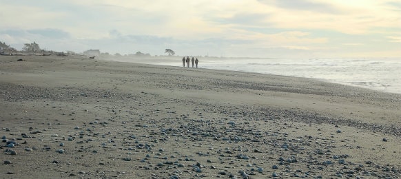 People Walking on Hokitika Beach, New Zealand